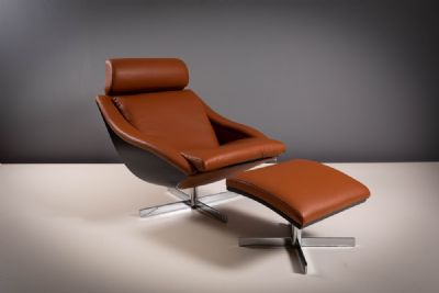 A TANNED LEATHER AND BEECH FRAMED 'BAKEA' SWIVEL ARMCHAIR AND FOOTSTOOL, by Roche Bobois sold for €3,000 at deVeres Auctions