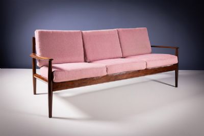 A ROSEWOOD SETTEE by Grete Jalk sold for €1,100 at deVeres Auctions