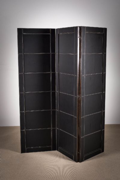 A LEATHER AND STAIN WOOD SCREEN at deVeres Auctions