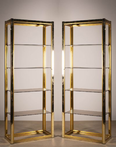 A PAIR OF GILT UPRIGHT SHELVES at deVeres Auctions