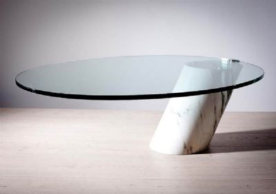 AN OVAL COFFEE TABLE at deVeres Auctions