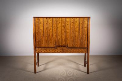 A ROSEWOOD UPRIGHT COCKTAIL CABINET at deVeres Auctions