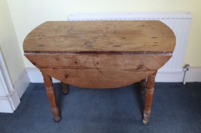 A DROPLEAF PITCHPINE TABLE at deVeres Auctions