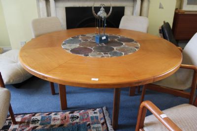 A LARGE CIRCULAR DINING TABLE at deVeres Auctions