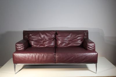 AN ITALIAN LEATHER TWO-SEATER SOFA, by Antonio Citterio sold for €1,400 at deVeres Auctions
