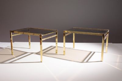 A PAIR OF GILT LOW TABLES, 1970s, with smoked glas at deVeres Auctions
