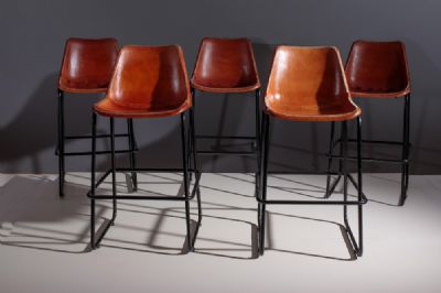 A SET OF FIVE INDUSTRIAL LEATHER BAR/KITCHEN ISLAND STOOLS, by ROCKET ST. GEORGE  at deVeres Auctions
