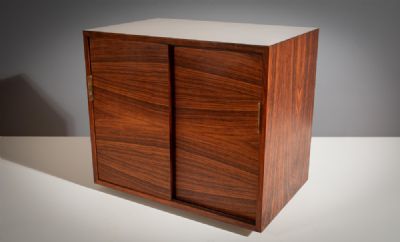 A ROSEWOOD BAR CABINET, ITALIAN 1960s, with slidin at deVeres Auctions