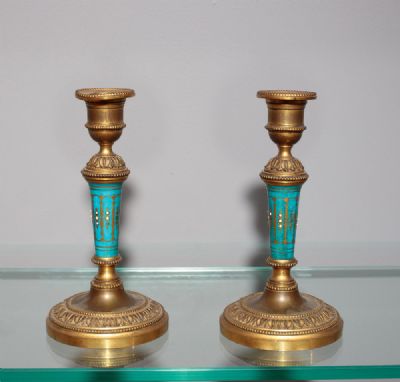 A PAIR OF GILT CANDLESTICKS, 19th CENTURY at deVeres Auctions