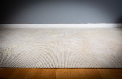 A LARGE FLOOR RUG at deVeres Auctions