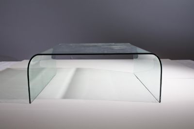 A MOLDED GLASS COFFEE TABLE, 1970s at deVeres Auctions