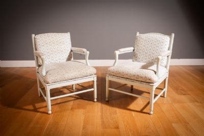 A PAIR OF FRENCH PAINTED OPEN ARMCHAIRS at deVeres Auctions