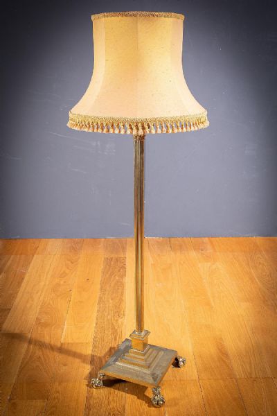 A BRASS STANDARD LAMP WITH CORINTHIAN CAPPED COLUMNS at deVeres Auctions