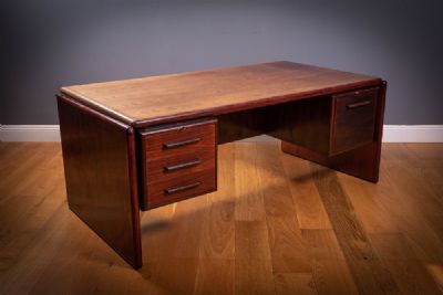 A DANISH ROSEWOOD EXECUTIVE DESK, by DYRLUND,  at deVeres Auctions