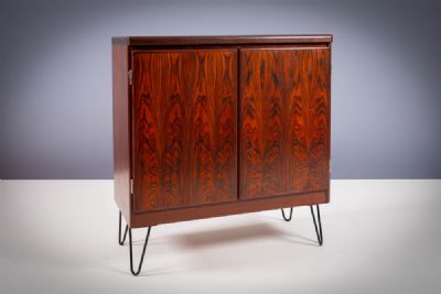 A ROSEWOOD TWO DOOR COCKTAIL CABINET, at deVeres Auctions