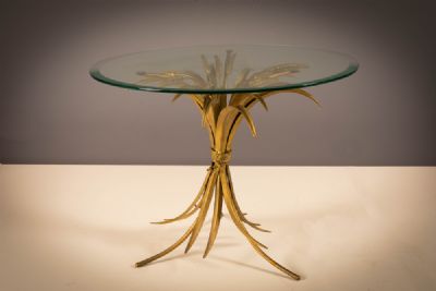 A GILT METAL SHEAF OF WHEAT CIRCULAR LOW TABLE, FRENCH 1970's. at deVeres Auctions
