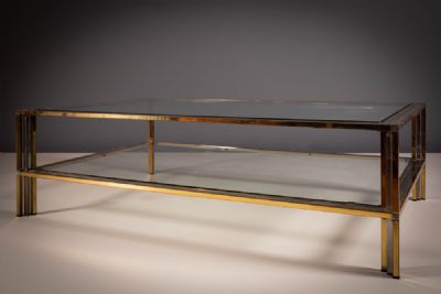 A CHROME AND GILT METAL TWO-TIER LOW TABLE. at deVeres Auctions