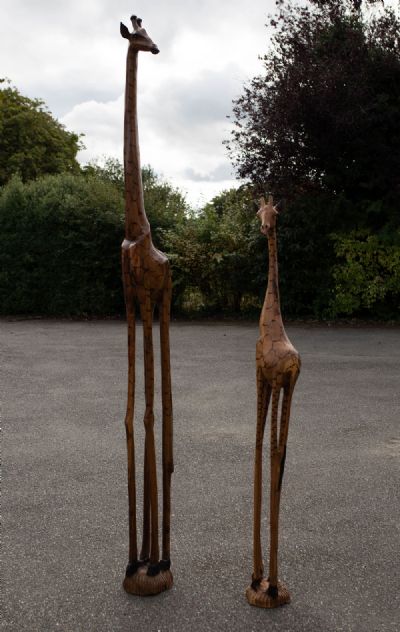 A LIFE SIZED CARVED WOOD MOTHER AND BABY GIRAFFE SET, 2 at deVeres Auctions