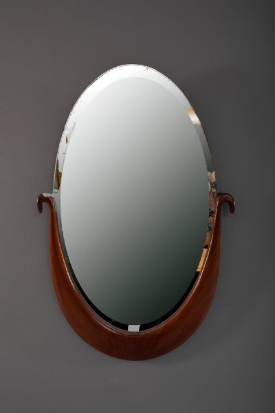 AN OVAL WALL MIRROR at deVeres Auctions