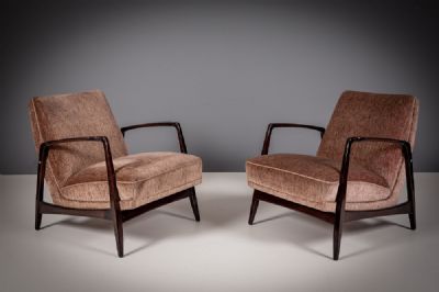 A PAIR OF LOW UPHOLSTERED ARMCHAIRS at deVeres Auctions