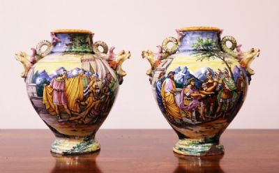 110 by A PAIR OF MAJOLICA URNS  at deVeres Auctions