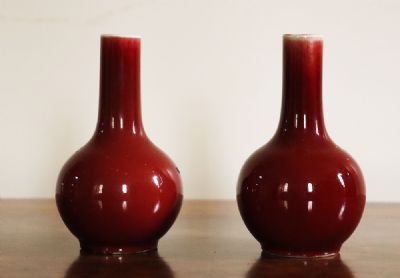 160 by A PAIr OF 'SANG-DE-BOEUF' VASES  at deVeres Auctions