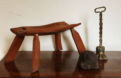 188 by A MILKING STOOL AND DOORSTOP  at deVeres Auctions