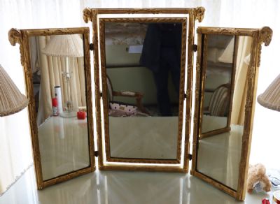 230 by A GILTWOOD TRIPTYCH MIRROR  at deVeres Auctions