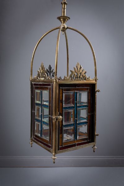 265 by A BRASS AND COLOURED GLASS SQUARE LANTERN  at deVeres Auctions