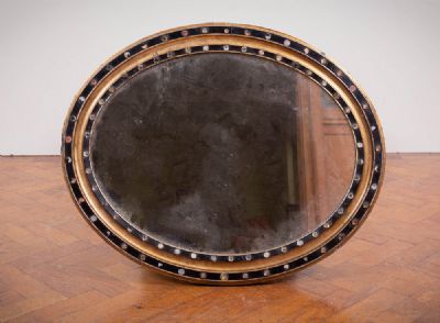 53 by AN OVAL MIRROR  at deVeres Auctions