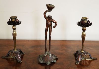 94 by A COPPER TOAD AND CANDLESTICKS  at deVeres Auctions