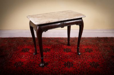 65 by AN IRISH MAHOGANY SIDE TABLE  at deVeres Auctions