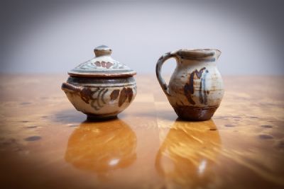 TWO MINIATURE POTS by Michael Cardew sold for €80 at deVeres Auctions