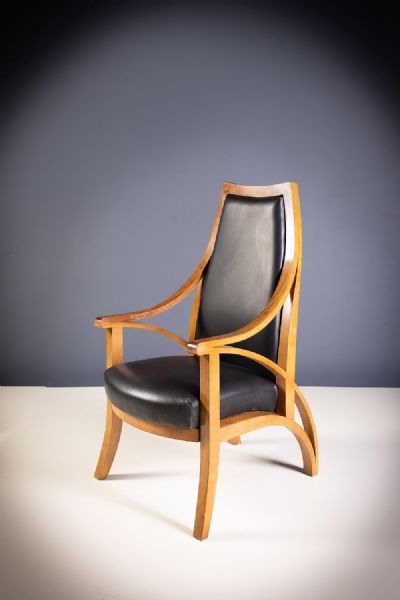 A WALNUT CHAIR by Michael Bell  at deVeres Auctions
